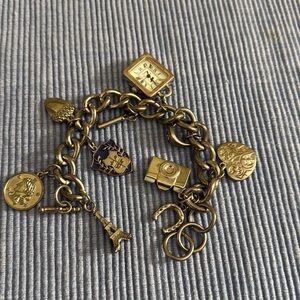 charm bracelet .silver tone , 8” long.10 pcs different charm